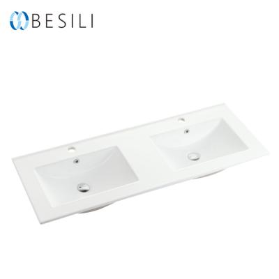 China Besili L120D Easy Clean CE Approved Ceramic Double Counter Bathroom Sink Foshan Hand Wash Basin for sale