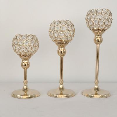 China Table flower centerpiece stand shiny champagne gold iron crystal ball cup candle holders for table centerpiece for sale