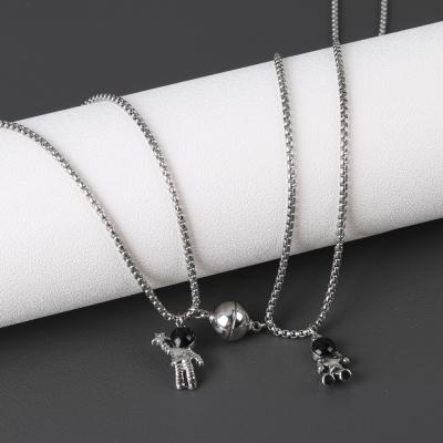 China Cute Hiphop Astronauts Magnet Attraction Dangling Couple Necklace Friendship Jewelry Creative Cool Chain Necklaces For Women Men Gift for sale