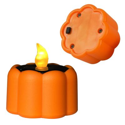 China Outdoor Waterproof Solar Powered Pumpkin Candle Warm White Flashing Lights for sale