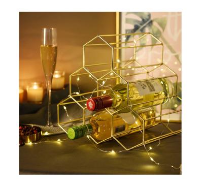 China Sustainable Modern Wrought Iron Bar Table Red Wine Storage Rack Gold For Countertop for sale