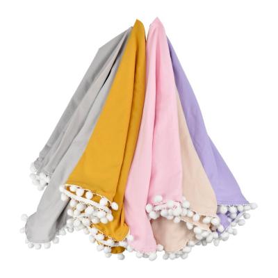 China 100% Cotton Organic Soft Touch Friendly Newborn Baby Anti-Pulling Wrap Swaddle Blanket With Pom Pom Lace for sale