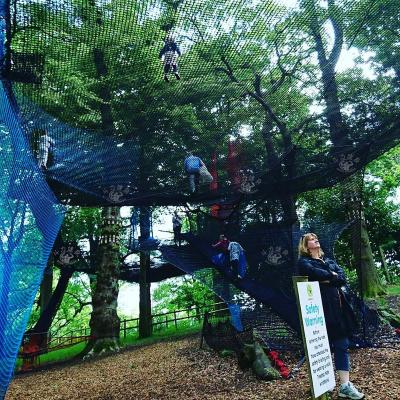 China Colorful Douli customizable outdoor attractive rope knitted climbing jumping sliding treetop net amusement park playground for children for sale