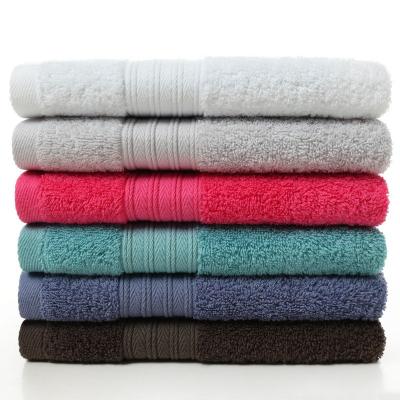 China Compressed Cheap Amazon Solid Color Dobby Face Towel Jacquard Bath Towel for sale