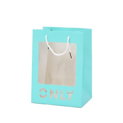 China Creative Recycled Materials Cavity Like Window Opening Gift Paper Bag Birthday Gift Handbag for sale