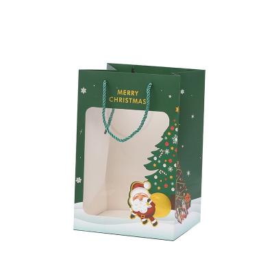 China Recycled Materials Store Merry Christmas Gift Wrapping Paper Bag Window Gift Exquisite Paper Bag for sale