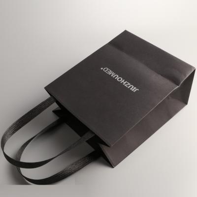 China Recycled Materials Custom Gift Small Luxury Black Paper Bag With Paper Handle for sale