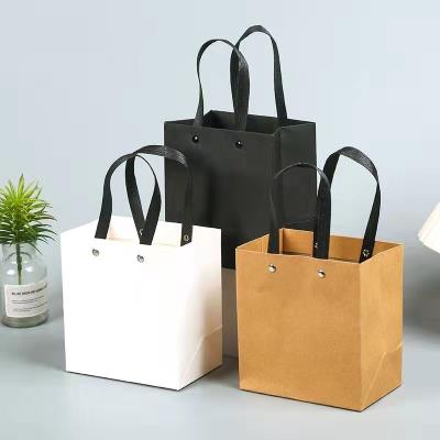 China Custom Recycled Rivet Materials Rivet Packaging Paper Luxury Gift Shopping Bag Portable Paper Bag With LOGO for sale