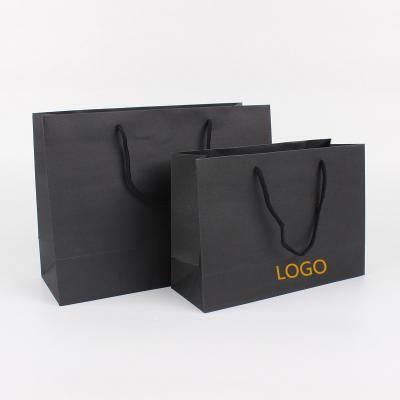 China Recycled Stock Black Materials Card Kraft Paper Bag Clothing Store Boutique Gift Bag Printed With Your Own Logo for sale