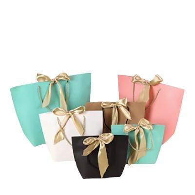 China Gift Paper Bag Packaging With Handle For Custom Clothing Shopping Bags Packing Items for sale