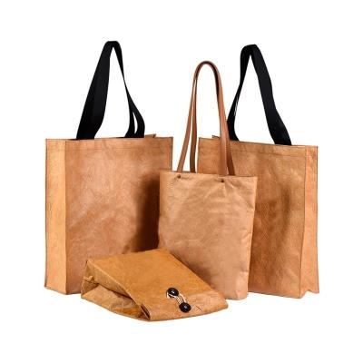 China Unisex Large Kneaded Washable Kraft Paper Hand Bag with Custom Logo and Single Handle for sale