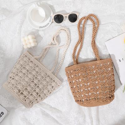 China Simple Casual Lady Summer Straw Handmade Bucket Bag for Women Beach Vacation Shoulder Bag for sale