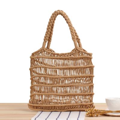 China Customized Color 2022 Summer Handmade Women Straw Bag Hollowed Out Woven Beach Hand Bag for sale