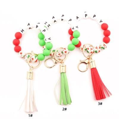 China G72 Promotional Gift G72 Leather Tassel Leather Key Ring Circle Charm Key Bracelet Christmas Pendant Silicone Beads Key Chain for sale