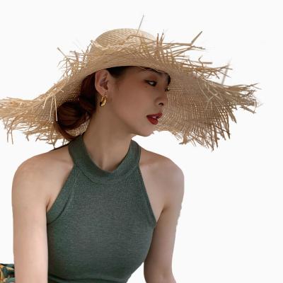 China Comfortable B5 Summer Sun Vacation Beach Cover Up Classic Big Wide Brim Straw Hats Fashion Panama Tassel Unisex Natural Straw Hat for sale