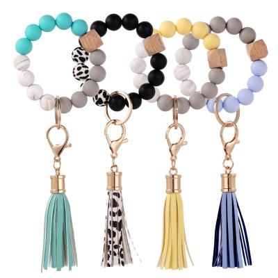 China DDA2433 promotion gift exaggerated tassel round silicone beads bracelet beaded keychain multicolor wooden silicone beads key chain for sale