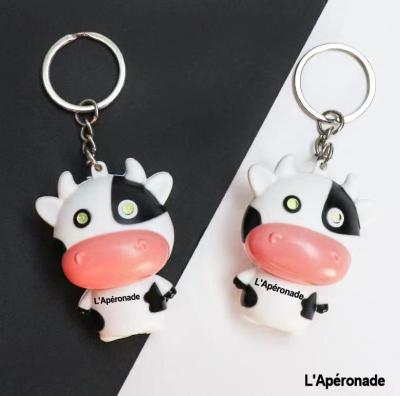 China Novelty Plastic Cartoon Mini Cow LED Cute Key Chain With Cow Key Chains Healthy Gifts for sale