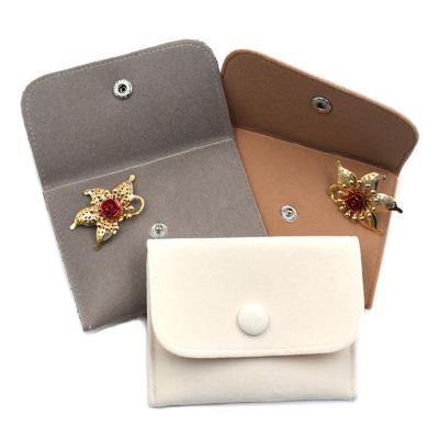 China Custom Recyclable Gold Foil Printed Drawstring Envelope Velvet Pouch Suede Jewelry Pouch With Metal Button for sale