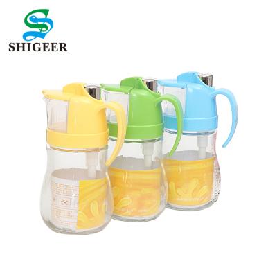 China Sustainable Wholesale Customized 600ML Green Cooking Use For Measuring Oil Glass Jar With Handle for sale