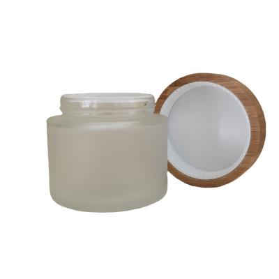 China Wholesale Cosmetic Body Scrub Container Frosted 200g Glass Jar With Bamboo Lid For Cosmetic Packaging for sale