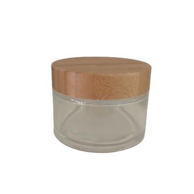 China Factory direct single glass clear frosted 150g cream jar cosmetic with bamboo cover plastic lid for cosmetic packaging for sale