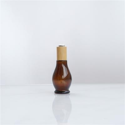 China Luxury Cosmetic Packaging Calabash Shape Serum Lotion Bottle With Eco Wood Pump for sale