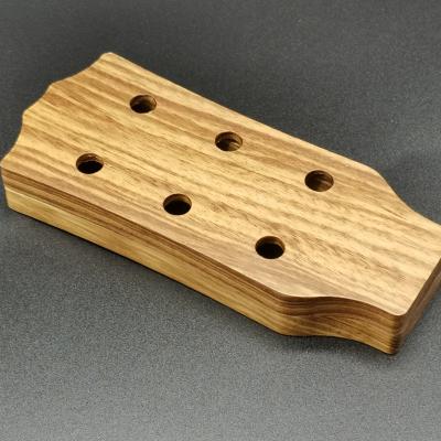 China Play and sing string instruments such as guitar/bass/ukulele factory direct selling can be customized new design shovel guitar pick solid wood box for sale