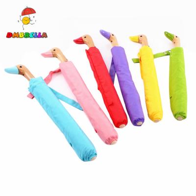 China Promotional/Advertising/Gift 50+ UV Shade Rain To Shine Travel Yellow Pink Wooden Duck Head Wood Handle Two Fold Umbrella for sale