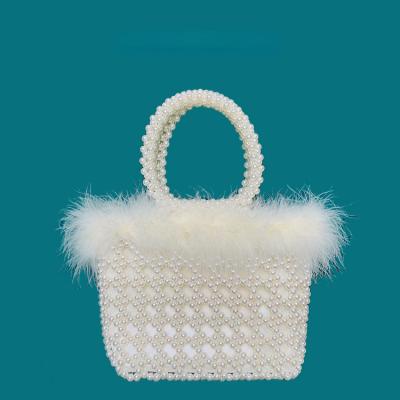 China Retro Japan style winter bead plush fur feather design fairy handbag woven classic hollow beaded bucket women handle beading bag for sale