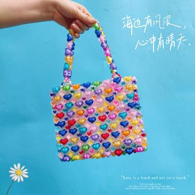 China Fashion Jelly Color Bead Candy Lipstick Summer Style Sweet Bag For Armpit Heart Shaped Handwoven Handbag For Girl for sale