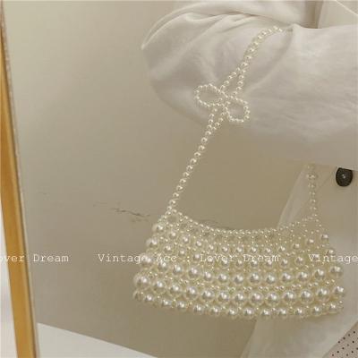 China Korean Temperament Bohemian Beaded Girl Commuter Bag Retro Flower Shoulder Bag Commuter Imitation Pearl Shoulder Handbag for sale