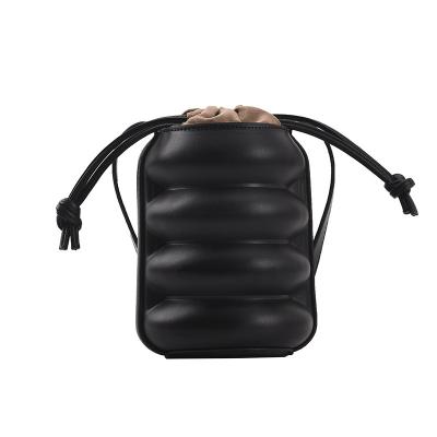 China Lady 2021 new fashion personality texture tire shape bag simple trend drawstring shoulder design texture oblique female bucket for sale