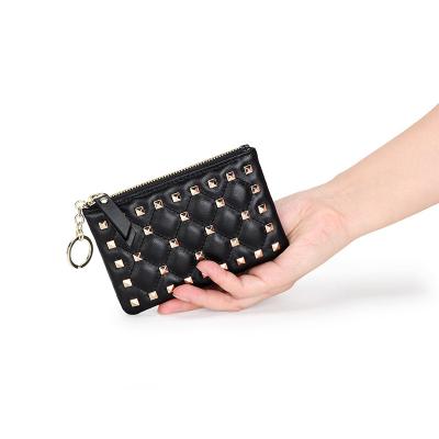 China 2021 Korean Fashion Shorts Coin Wallet Key Zipper Ladies Wallet Card Bag New Rivets Leather Coin Bag for sale