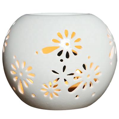 China Sustainable Round Hollow Ceramic Aroma Essential Oil Wax Melt Burner for sale