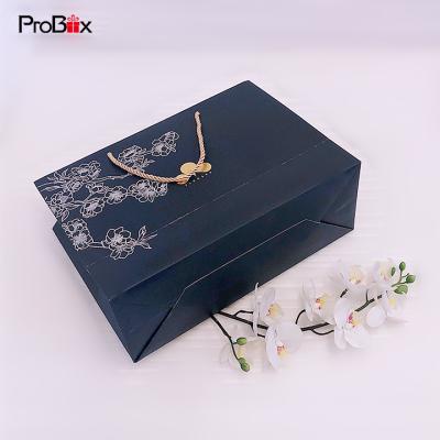 China Recycled materials customized hot paper bag factory sale custom doorgift bags logo luxury shopping white luxury shopping supplier for sale