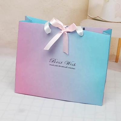 China Carry Reusable Shopping Packaging Custom Clothing Pink Luxury Gift Paper Mall Cosmetic Paper Bag For Cosmetics Packaging Bags With Ribbon Handle for sale