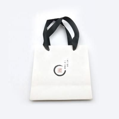 China Custom Quality Materials Fashion White Paper Bag Recycled Size Shopping Tote With Ribbon Handle for sale