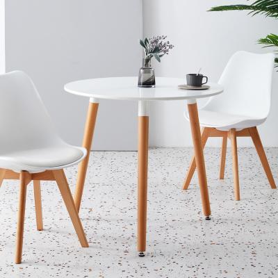 China Nordic Luxury Cheap Modern Dining Glass Top Dine Table Minimalist Free Sample Restaurant Furniture Three Legs Wooden Round Low Dining Table for sale