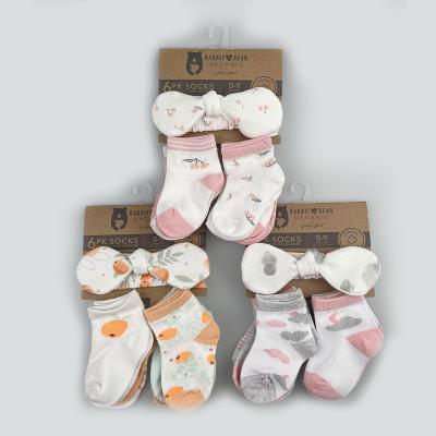 China Sustainable Newcomer 2022 Organic Cotton 6 PK Socks With Matching Headband For Plus Size Fits Newborns 0-9 Months One for sale