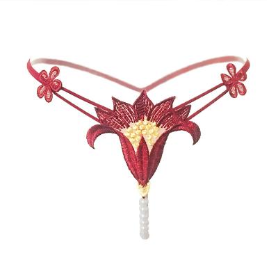 China Interest antibacterial sexy hot underwear hollow pearl massage low waist elastic temptation a rope flower thong for sale