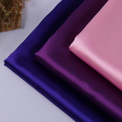 China Sustainable Wholesale 50D stretch polyester satin silk fabric poly textile for robe pajamas for sale