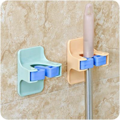 China Wall Mount Reusable Super Anti-Slip Clamp Stands Self Adhesive No Broom Dustpan Storage Rack Drill Hanger for sale