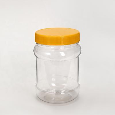 China 500ml Food Jar 16oz Round Plastic Containers Pet Plastic Bottles Handle Cap Pantry Canisters for sale