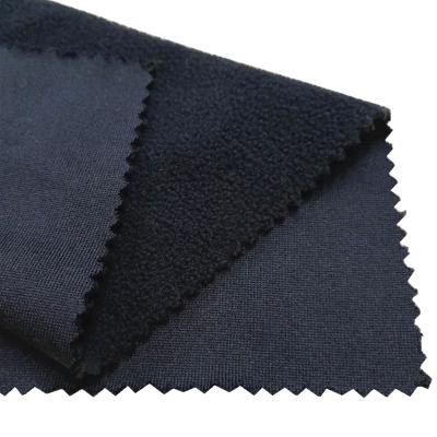 China Anti-Static Black Waterproof Fleece Fabrics Suppliers Water Repellent Navy Fabric Bond Stretch For Soft Construction Coat for sale