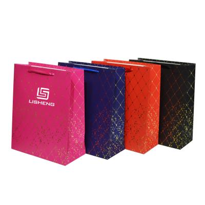 China Custom colorful printed luxury paper bag recycled material A4 size with your own logo with handle for sale