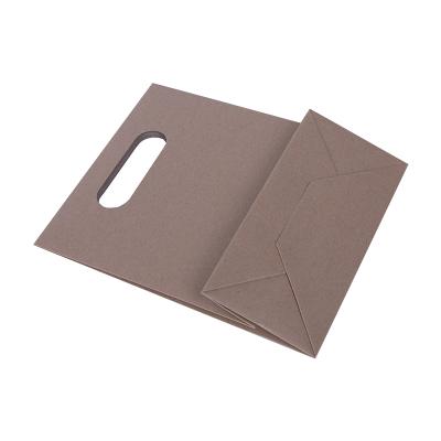 China Good quality material low cost low moq recycled custom your own logo recycle brown kraft paper shopping bag with cut handle for sale