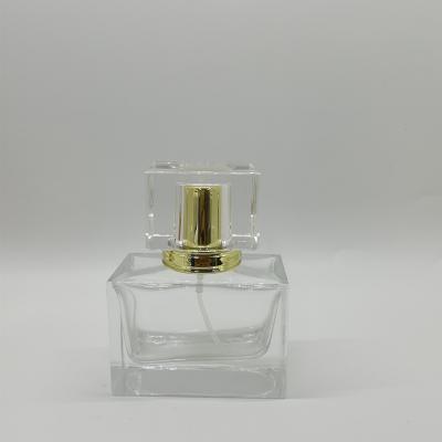 China Personal Care 30ml Square Spray Glass Clear Perfume Bottle With Pump For Cosmetic Packaging for sale