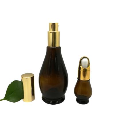 China Personal care 10ml 20ml 30ml 50ml 100ml simple essential oil gourd shape dark brown glass bottle with gold dropper for sale