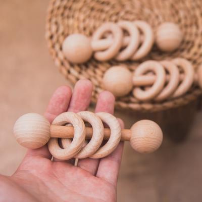 China Toy Wholesale Beech Wood Baby Musical Practicing Toys Rattles Wooden Baby Teething Toys for sale