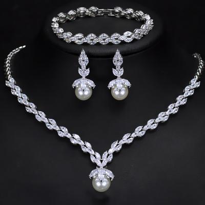 China FASHIONABLE Zircon Bride AAA Anti-Allergy Set Shell Pearl Bracelet Earring Necklace Three-Piece Set for sale